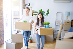 Couple moving in to their new home - Why Buy There Unless You Want To Live There? 