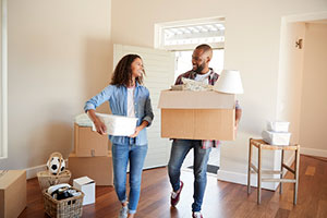 A couple moving into their own house