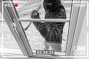 home security - burglary in action at window