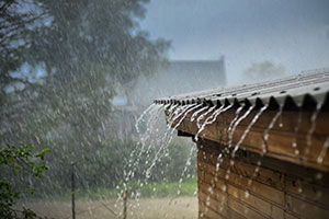 A house being hit by storm damage