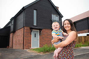 Homeowners outside their new home in Alfred's Gate