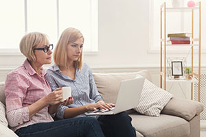 mum and daughter on computer 